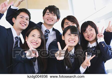 Stock Photograph - Japanese high-school student taking group shot in classroom. Fotosearch