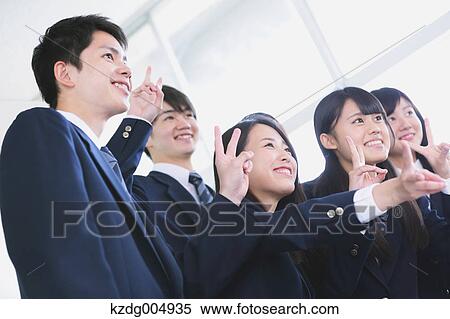 Stock Photography - Japanese high-school student taking group shot in classroom. Fotosearch