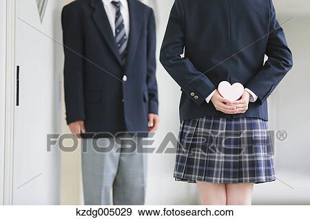 Japanese high-school student waiting to give present View Large Photo Image Stock Photo - Japanese high-school student waiting to give present. Fotosearch