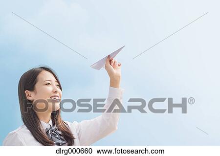Japanese high-school student with paper plane View Large Photo Image Stock Image - Japanese high-school student with paper plane. Fotosearch