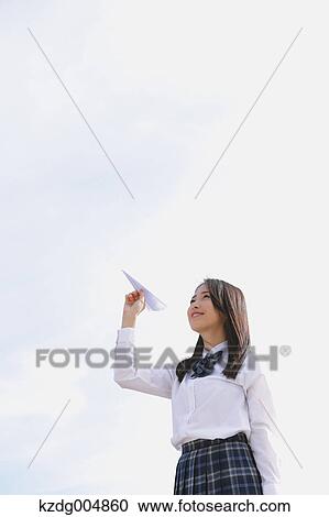 Japanese high-school student with paper plane View Large Photo Image Stock Image - Japanese high-school student with paper plane. Fotosearch