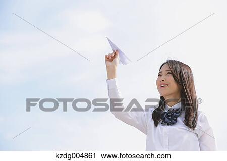 Japanese high-school student with paper plane View Large Photo Image Stock Image - Japanese high-school student with paper plane. Fotosearch