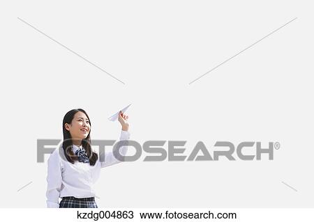 Japanese high-school student with paper plane View Large Photo Image Stock Image - Japanese high-school student with paper plane. Fotosearch