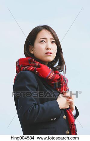 Japanese high-school student with scarf against blue sky View Large Photo Image Picture - Japanese high-school student with scarf against blue sky. Fotosearch