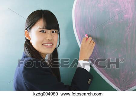 Japanese high-school student writing on classroom blackboard View Large Photo Image Stock Image - Japanese high-school student writing on classroom blackboard. Fotosearch