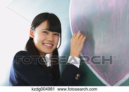 Japanese high-school student writing on classroom blackboard View Large Photo Image Stock Image - Japanese high-school student writing on classroom blackboard. Fotosearch