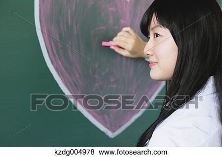 Japanese high-school student writing on classroom blackboard View Large Photo Image Stock Photo - Japanese high-school student writing on classroom blackboard. Fotosearch