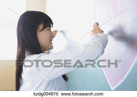 Japanese high-school student writing on classroom blackboard View Large Photo Image Stock Photography - Japanese high-school student writing on classroom blackboard. Fotosearch