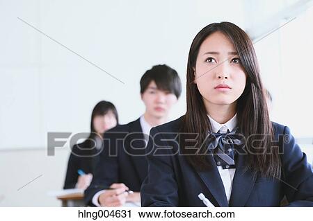Stock Image - Japanese high-school students during a lesson. Fotosearch