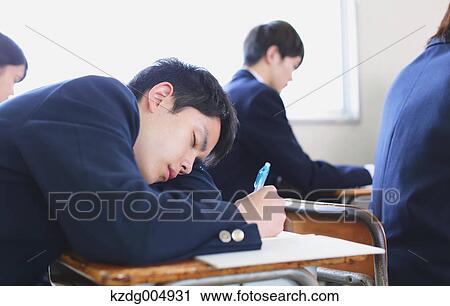 Stock Image - Japanese high-school students during a lesson. Fotosearch