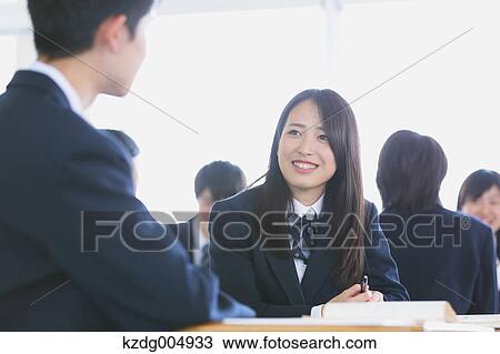 Stock Image - Japanese high-school students during a lesson. Fotosearch