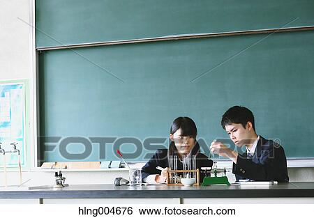 Stock Photograph - Japanese high-school students in empty classroom. Fotosearch