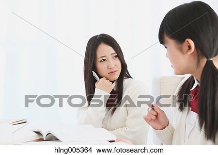 Japanese High-school students in uniform studying together View Large Photo Image Picture - Japanese High-school students in uniform studying together. Fotosearch