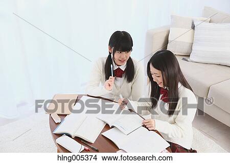 Japanese High-school students in uniform studying together View Large Photo Image Picture - Japanese High-school students in uniform studying together. Fotosearch