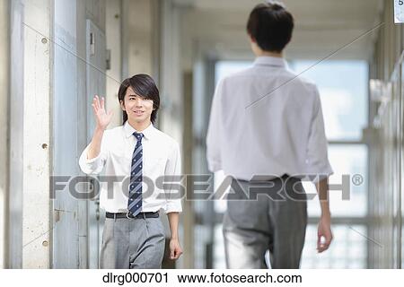 Stock Image - Japanese high-school students in school corridor. Fotosearch
