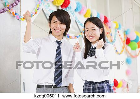 Stock Image - Japanese high-school students in decorated school corridor. Fotosearch