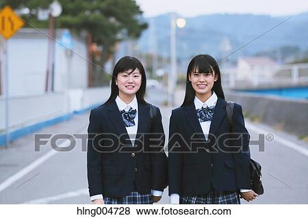 Stock Photo - Japanese high-school students outside the school. Fotosearch