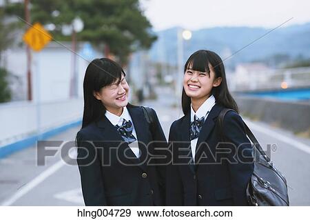 Stock Photo - Japanese high-school students outside the school. Fotosearch