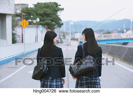 Stock Photograph - Japanese high-school students outside the school. Fotosearch