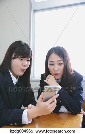 Japanese high-school students with smartphone in classroom View Large Photo Image Stock Photography - Japanese high-school students with smartphone in classroom. Fotosearch