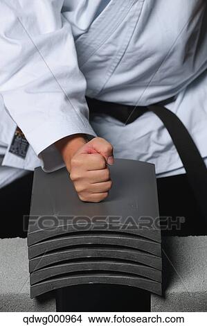 Japanese karate master breaking tiles View Large Photo Image Picture - Japanese karate master breaking tiles. Fotosearch