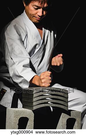Japanese karate master breaking tiles View Large Photo Image Picture - Japanese karate master breaking tiles. Fotosearch