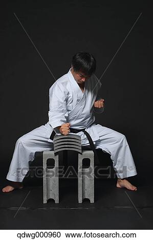 Japanese karate master breaking tiles View Large Photo Image Stock Image - Japanese karate master breaking tiles. Fotosearch