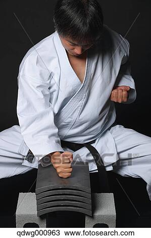 Japanese karate master breaking tiles View Large Photo Image Stock Image - Japanese karate master breaking tiles. Fotosearch
