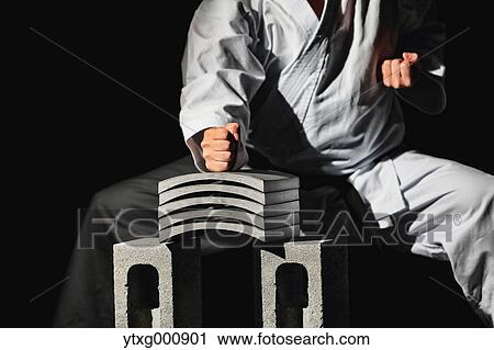 Japanese karate master breaking tiles View Large Photo Image Stock Image - Japanese karate master breaking tiles. Fotosearch