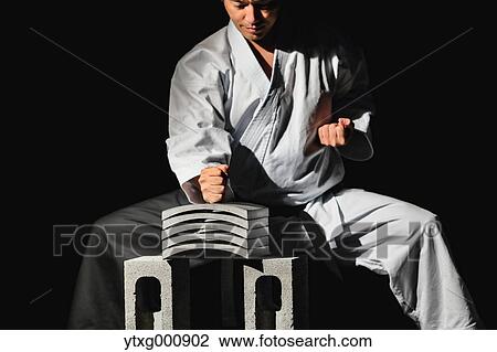 Japanese karate master breaking tiles View Large Photo Image Stock Image - Japanese karate master breaking tiles. Fotosearch