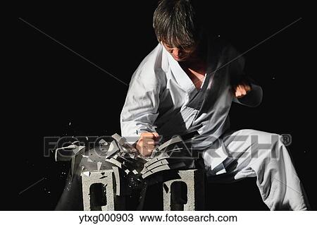 Japanese karate master breaking tiles View Large Photo Image Stock Image - Japanese karate master breaking tiles. Fotosearch