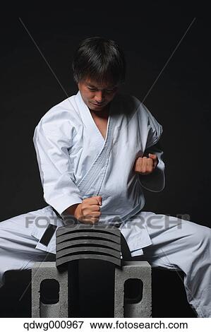 Japanese karate master breaking tiles View Large Photo Image Stock Photo - Japanese karate master breaking tiles. Fotosearch