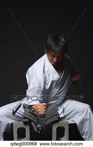 Japanese karate master breaking tiles View Large Photo Image Stock Photo - Japanese karate master breaking tiles. Fotosearch