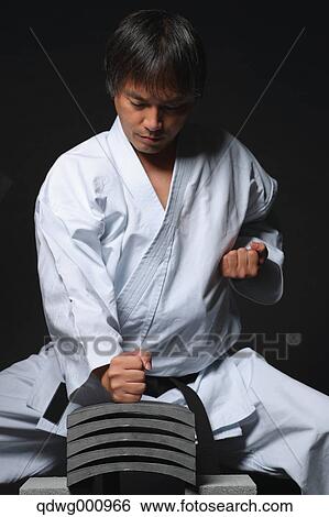 Japanese karate master breaking tiles View Large Photo Image Stock Photograph - Japanese karate master breaking tiles. Fotosearch