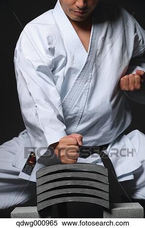 Japanese karate master breaking tiles View Large Photo Image Stock Photography - Japanese karate master breaking tiles. Fotosearch