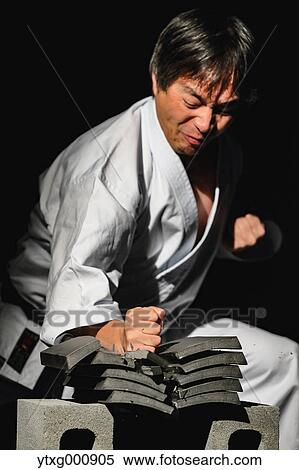 Japanese karate master breaking tiles View Large Photo Image Stock Photography - Japanese karate master breaking tiles. Fotosearch