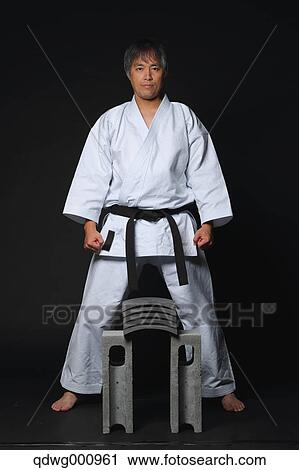 Japanese karate master focusing before breaking tiles View Large Photo Image Stock Image - Japanese karate master focusing before breaking tiles. Fotosearch