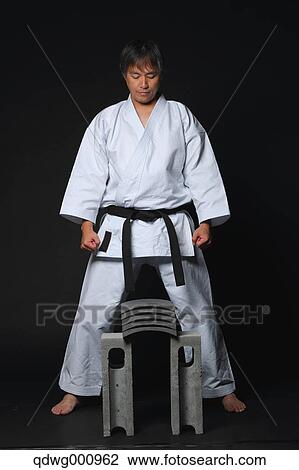 Japanese karate master focusing before breaking tiles View Large Photo Image Stock Image - Japanese karate master focusing before breaking tiles. Fotosearch