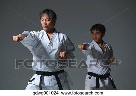 Picture - Japanese karate masters fighting. Fotosearch