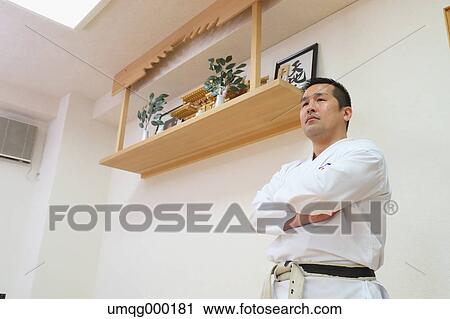 Stock Image - Japanese karate teacher in uniform. Fotosearch