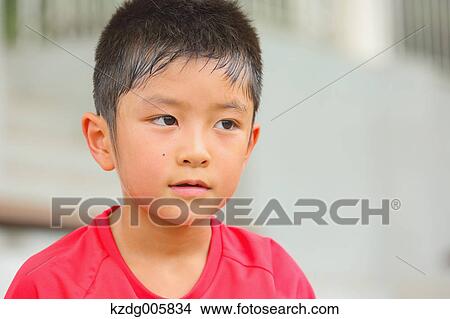 Picture - Japanese kid at soccer field. Fotosearch