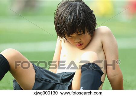 Stock Image - Japanese kid at soccer field. Fotosearch