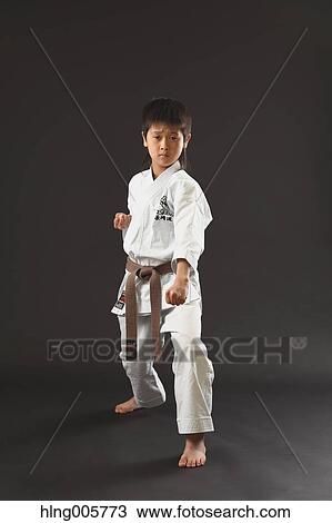 Japanese kid in karate uniform on black background View Large Photo Image Stock Image - Japanese kid in karate uniform on black background. Fotosearch
