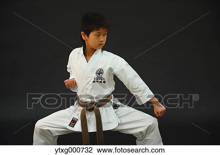 Japanese kid in karate uniform on black background View Large Photo Image Stock Image - Japanese kid in karate uniform on black background. Fotosearch