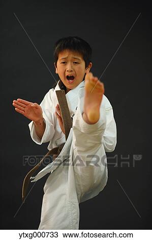 Japanese kid in karate uniform on black background View Large Photo Image Stock Image - Japanese kid in karate uniform on black background. Fotosearch