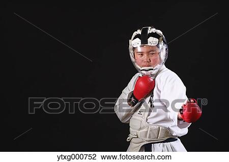 Japanese kid in karate uniform on black background View Large Photo Image Stock Image - Japanese kid in karate uniform on black background. Fotosearch