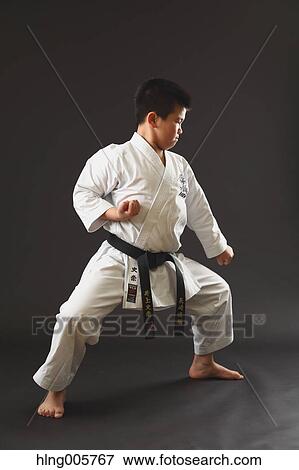 Japanese kid in karate uniform on black background View Large Photo Image Stock Photo - Japanese kid in karate uniform on black background. Fotosearch