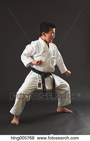 Japanese kid in karate uniform on black background View Large Photo Image Stock Photo - Japanese kid in karate uniform on black background. Fotosearch