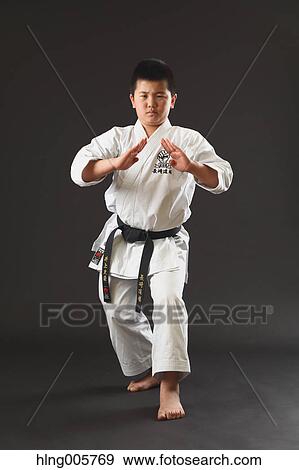 Japanese kid in karate uniform on black background View Large Photo Image Stock Photo - Japanese kid in karate uniform on black background. Fotosearch
