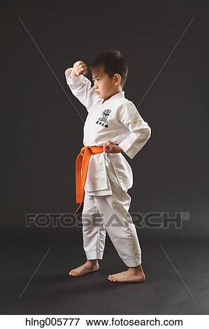 Japanese kid in karate uniform on black background View Large Photo Image Stock Photo - Japanese kid in karate uniform on black background. Fotosearch